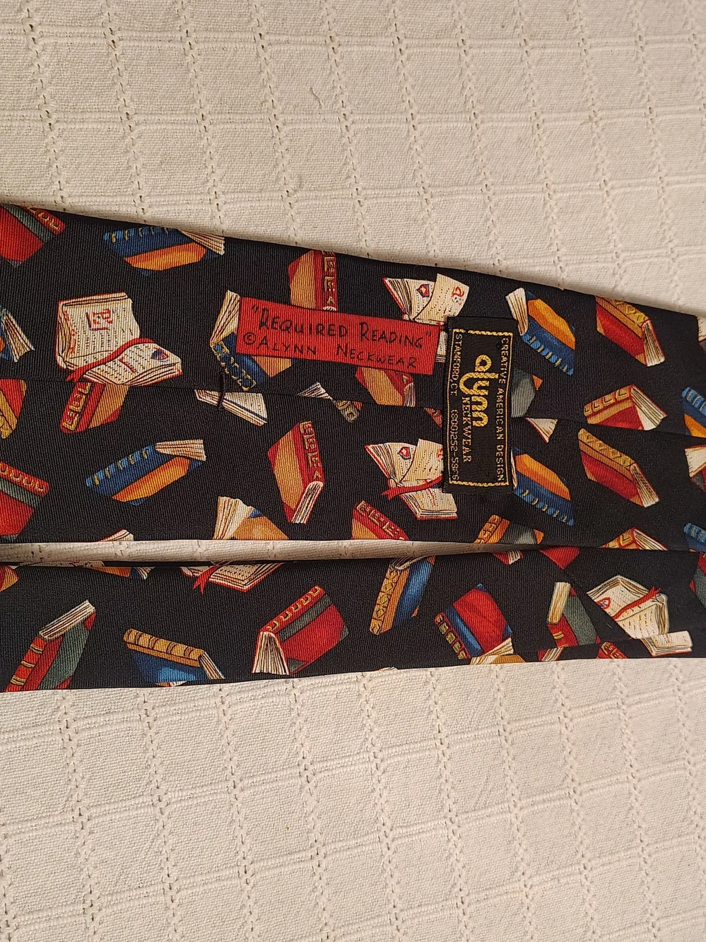 Novelty Book Print Silk Tie in Black with Red, Blue and Gold Books